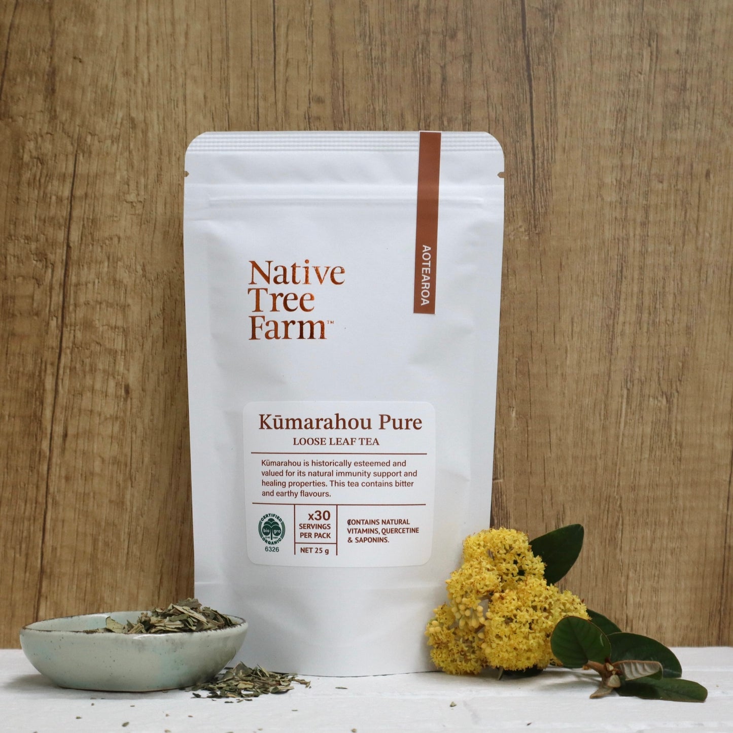 Kumarahou Pure loose leaf tea package by Native Free Farm on a wooden background.