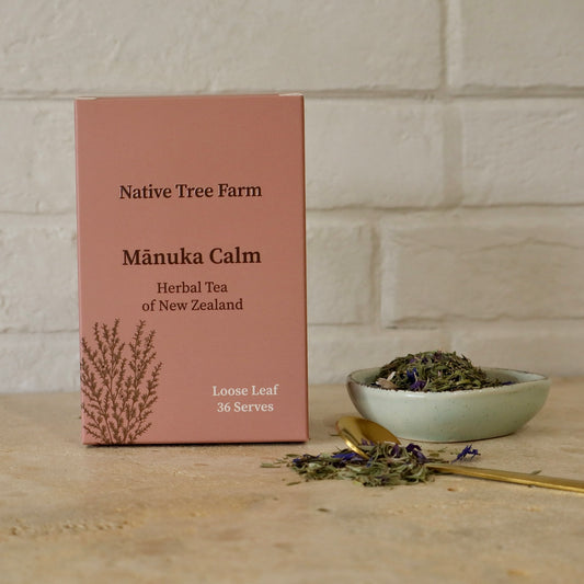 Native Tree Farm Mánuka Calm herbal tea loose leaf packaging in a box, shown next to a small bowl of manuka calm loose tea.