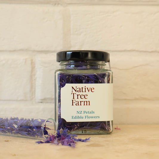jar of edible purple and blue flower petals from Native Tree Farm on the kitchen bench