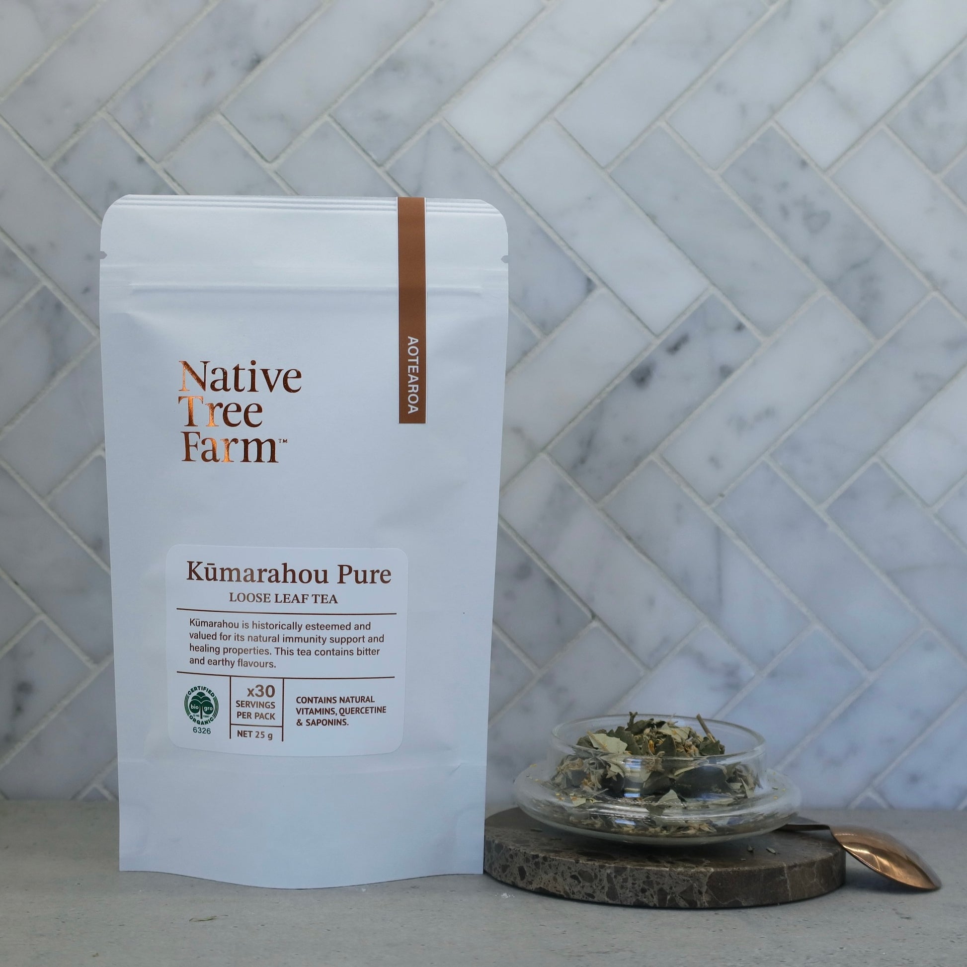 Native Tree Farm certified organic Kumarahou herbal tea in package on a kitchen marble bench 