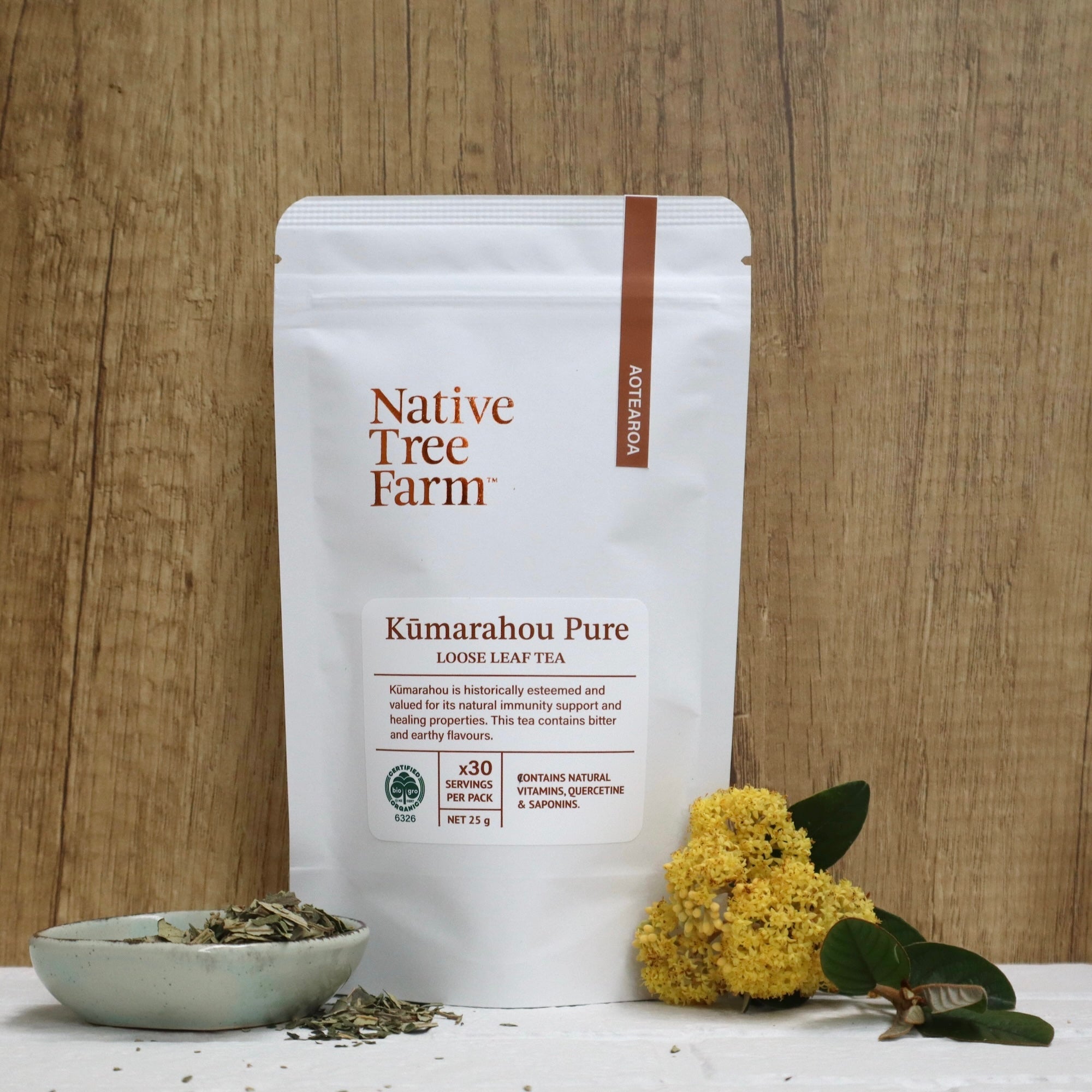 Kumarahou Pure loose leaf tea package by Native Free Farm on a wooden background.