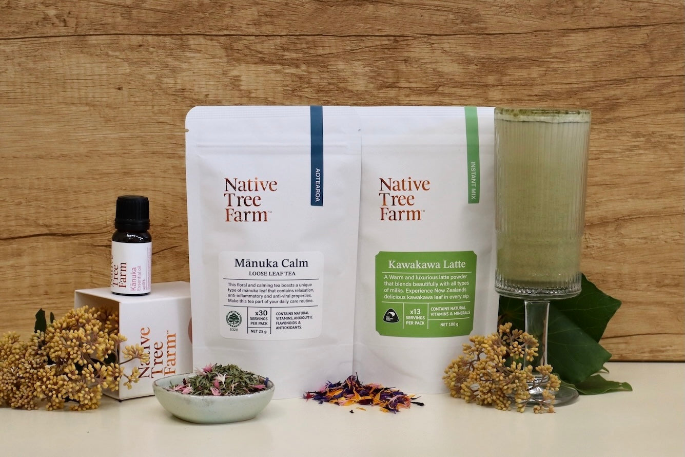 native tree farm products, including their kawakawa latte in a glass cup, kumarahou flowers and tea packaging.