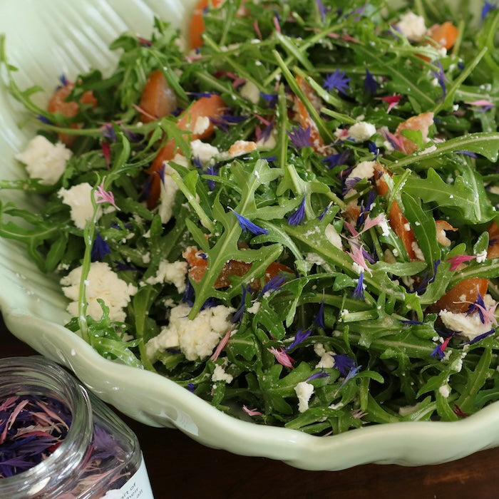 Native Tree Farm edible flower petals in a green salad