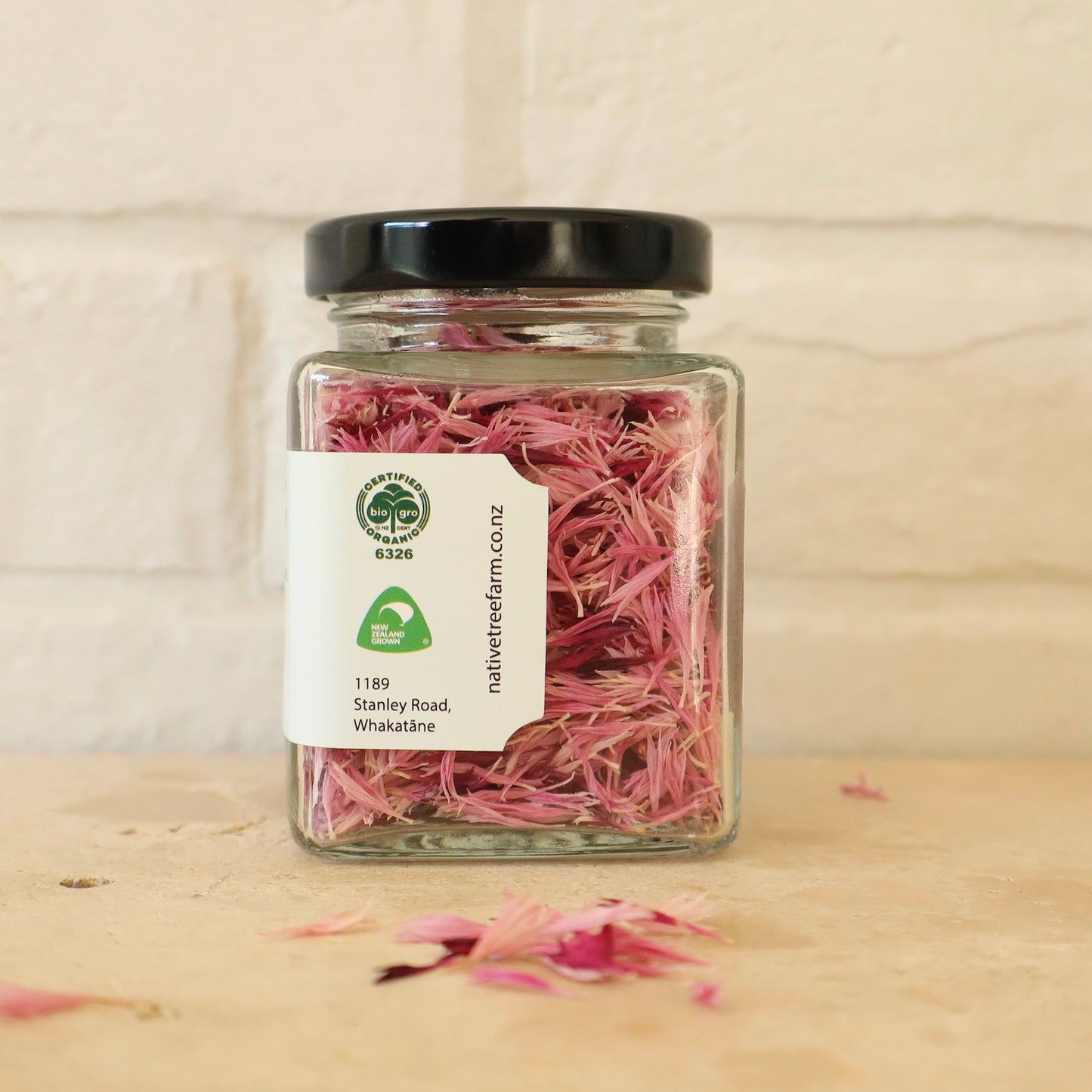 Jar of pink edible cornflower petals from Native Tree Farm